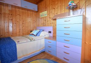 A bed or beds in a room at La Casita de Chocolate