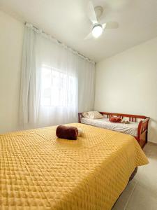 a bedroom with two beds and a ceiling fan at Casa c WiFi e vista para o mar-Barra de São João RJ in Casimiro de Abreu