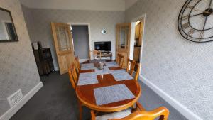 a dining room with a table and chairs at STAY - at Southport Holiday Home - sleeps 6 in Southport