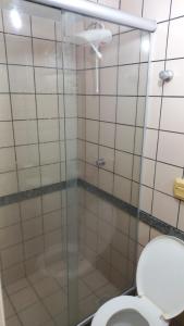 a bathroom with a shower and a toilet at diRoma Rio Quente - Para Voce se Sentir em Casa :D in Rio Quente