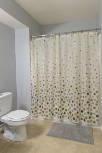 a bathroom with a toilet and a shower curtain at King Bed, TV's in Every Bedroom, Bring Your Pets! KMS1309 in Manhattan
