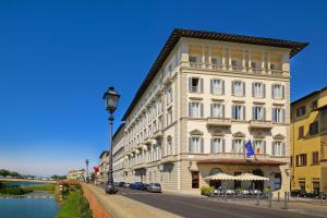 a large white building on the side of a street at The St. Regis Florence in Florence