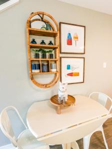 a white dining room table with a mirror on the wall at Duplex allows for one or both sides to be rented! Suitable for small or large families! in Gulf Shores