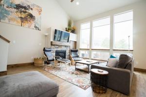 a living room with a couch and a fireplace at Close to RMNP, Estes,& Amenities in Estes Park