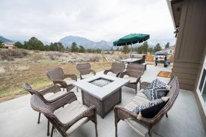a group of chairs and a table on a patio at Close to RMNP, Estes,& Amenities in Estes Park