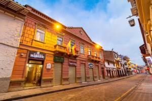 a colorful building on the side of a street at Hotel Majestic 1 in Cuenca