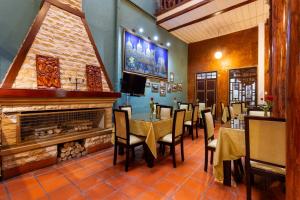 Μια τηλεόραση ή/και κέντρο ψυχαγωγίας στο Hotel Majestic 1 Centro histórico Cuenca