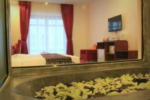 TV a/nebo společenská místnost v ubytování Mekong Angkor Palace Hotel