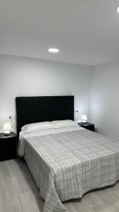 Posteľ alebo postele v izbe v ubytovaní Apartamento FELICIA