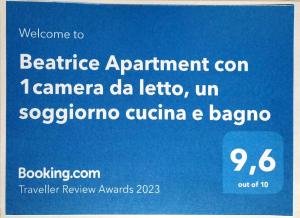 una señal azul que dice bienvenido a vencer a Apartmentcon camanca carta de datos en Beatrice Apartment con 1camera da letto, un soggiorno cucina e bagno en Scordia