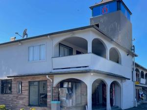 a building with a lighthouse on top of it at Motel 6 Richmond CA Civic Center in Richmond