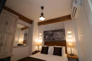 a bedroom with a bed and a mirror at Life is Good Cartagena Hostel in Cartagena de Indias