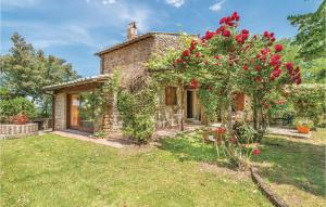 an external view of a stone house with a garden at Villa Luna in Vitorchiano