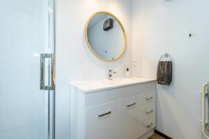 a bathroom with a sink and a mirror at Little Black Ski Chalet | Central, WiFi, Families! in Methven +42 photos