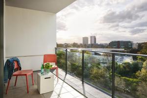 a balcony with a view of a city at Punthill Norwest in Baulkham Hills