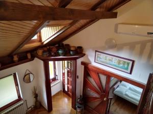 an attic room with wooden ceilings and a wooden door at Holiday house with a parking space Jakovci Netreticki, Karlovac - 20279 in Netretić