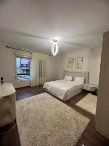 En eller flere senger på et rom på Lovely Apartment New giza