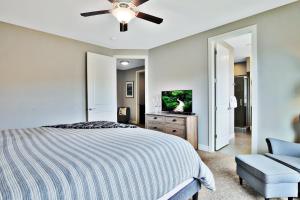 a bedroom with a bed and a ceiling fan at Entrada at Moab 424 in Moab