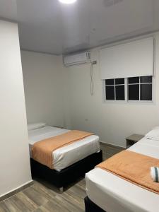 Ένα ή περισσότερα κρεβάτια σε δωμάτιο στο Providence Paradise Apartamento