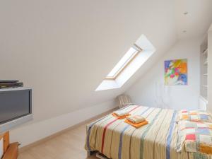a white bedroom with a bed and a skylight at Duplex 4 pièces, balcon, 6 pers, Châtelaillon-Plage, Wi-Fi - FR-1-535-38 in Châtelaillon-Plage
