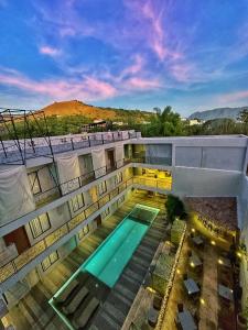 an overhead view of a building with a swimming pool at Zenvea Hotel in Coron