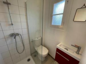 a bathroom with a shower and a toilet and a sink at Maison Capbreton, 3 pièces, 4 personnes - FR-1-413-116 in Capbreton