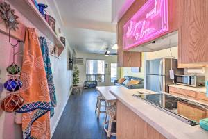 a kitchen with a counter and a dining room at Parker Studio with Patio and Direct River Access! in Parker