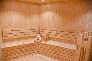 a wooden sauna with a teddy bear sitting in it at Welcomhotel by ITC Hotels, Devee Grand Bay, Visakhapatnam in Visakhapatnam