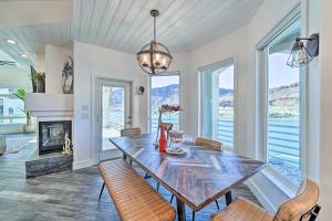 a dining room with a table and chairs and a fireplace at Spacious Parker House on the Colorado River! in Parker