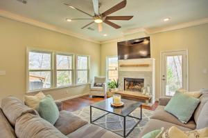 a living room with a couch and a fireplace at Wooded Pottsboro Escape about 1 Mi to Lake Texoma in Pottsboro