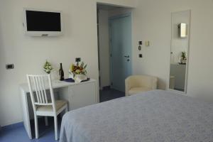 Ένα ή περισσότερα κρεβάτια σε δωμάτιο στο Hotel La Sorgente