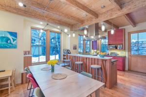 a kitchen and dining room with a wooden table and chairs at Sun-Filled Sunnyside Home On North Fir St - Eco-Friendly Home - Peace & Privacy home in Telluride