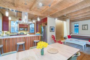 a kitchen and living room with a table and chairs at Sun-Filled Sunnyside Home On North Fir St - Eco-Friendly Home - Peace & Privacy home in Telluride