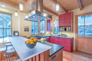 a kitchen with a bowl of fruit on a counter at Sun-Filled Sunnyside Home On North Fir St - Eco-Friendly Home - Peace & Privacy home in Telluride