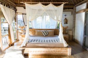 Postel nebo postele na pokoji v ubytování Le Yanandra Bali Resort