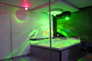 a room with a large aquarium with fish in it at Motel Vitória (Adult only) in Rialma +24 photos