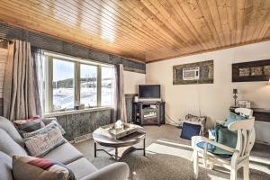 a living room with a couch and a tv at Family Home - Walk to Town and Balsam Lake! in Balsam Lake