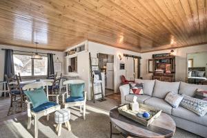 a living room with a couch and a table at Family Home - Walk to Town and Balsam Lake! in Balsam Lake