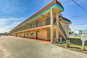 a large building with a road in front of it at Sunny St Augustine Condo with Community Pool! in Saint Augustine