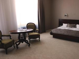 Postel nebo postele na pokoji v ubytování Hotel Lev