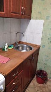 a kitchen counter with a sink in a kitchen at Квартира посуточно недорого in Chernihiv