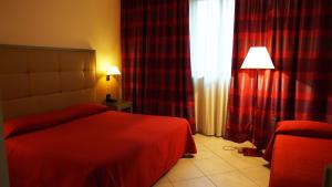 Postel nebo postele na pokoji v ubytování Garden Hotel