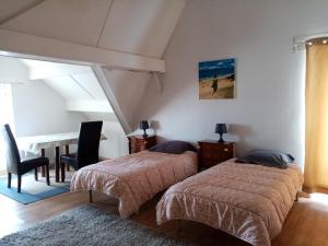 Llit o llits en una habitació de Chambres d'Hôtes L'Insulaire