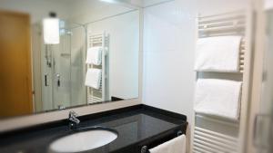Koupelna v ubytování Garden Hotel