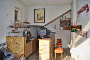 a kitchen with a sink and a counter in a room at Hostel Cuba in Banja Luka