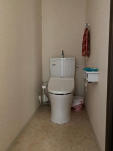 a bathroom with a toilet in the corner of a room at 山科車站yamashina in Kyoto