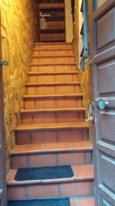 a set of stairs with a door and a door at Cavour Apartment in Syracuse