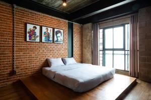 Ένα ή περισσότερα κρεβάτια σε δωμάτιο στο Any Day House Huahin