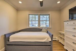 a bedroom with a bed and a window at Mattituck Home with Fireplaces - Near Wineries in Mattituck