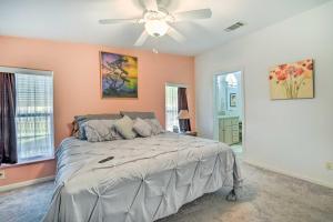 a bedroom with a bed and a ceiling fan at Wildwood Vacation Rental Near Golf and Dining! in Wildwood